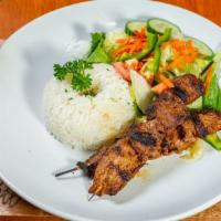 Beef Anticuchos · Marinated grilled meat on skewers. Served with rice.