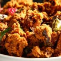 Mixed Vegetable Pakora · Sliced battered mixed vegetables like bell pepper, cauliflower, spinach fritters. Served wit...