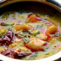 Dal Tadka · Yellow Lentils sautéed with Onions, Tomatoes and Indian spices