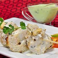 Malai Tikka Kabob · Boneless chicken marinated in our creamy garlic marinade and grilled in Tandoor
