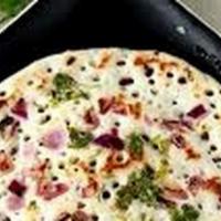 Uthappam · Thick rice and lentil savory pancakes sprinkled with onions and chilies. Served with chutney...