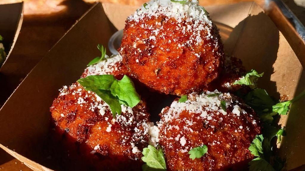 Crispy Mac & Cheese Balls · Crispy Mac & Cheese Balls topped with Cilantro and Cotija Cheese served with our House Made Horseradish Sauce.