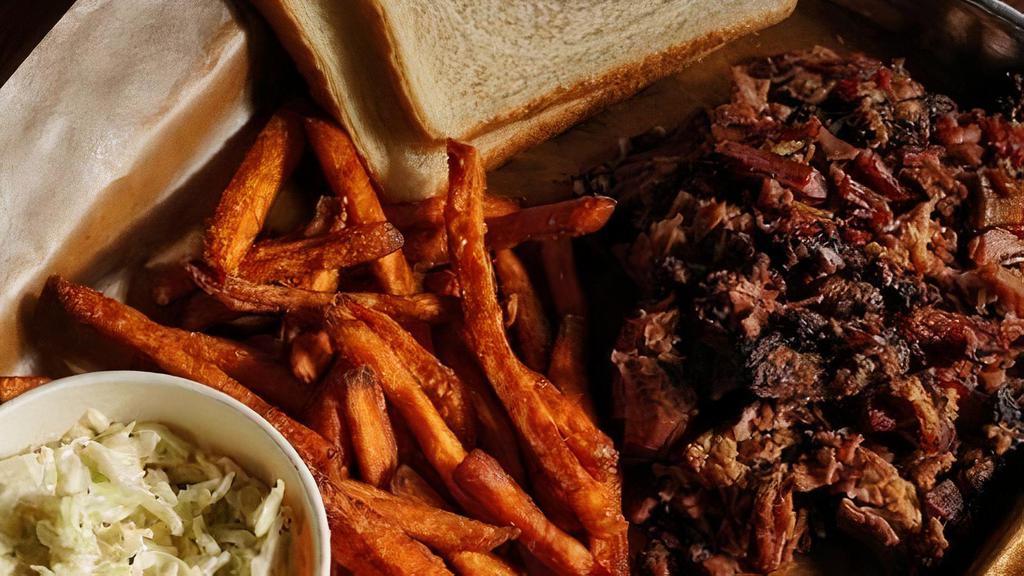 Chopped Brisket Plate · Our House Smoked Chopped Brisket Plate is Served with Your Choice of Two Sides, Pickles, Red Onions and Two Slices of Bread.