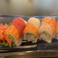Rainbow Roll · Inside: crab meat, avocado and cucumber. Top: sliced avocado and assorted sashimi.