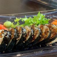 Spider Roll · Inside: soft shell crab, crab meat, avocado, cucumber and fish egg with eel sauce on top.