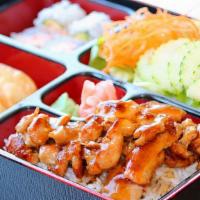 Chicken Bento Box · Served with garden salad, four pieces california roll, three pieces dumplings, choices of st...