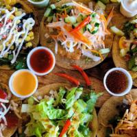 Specialty Taco Trio (3) · * (3) traditional tacos topped with SPECIAL TOPPINGS + sauce on side*

[SPECIALTY TOPPINGS] ...