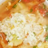 Soup De Pollo · Chicken soup with rice, onions, tomato, avocado, jalapeno and cilantro.