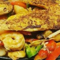 Fajitas Del Mar · Shrimp, fish, crab meat and scallops with mushrooms, bell peppers, onion, and tomatoes.