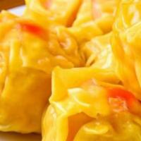 Khanom Jeeb Gai · Steamed thai dumplings filled with ground chicken and mixed veggies served with savory dark ...