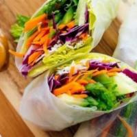 Fresh Summer Rolls · Lettuce, carrot, basil, purple cabbage wrapped in rice paper serve with peanut sauce.