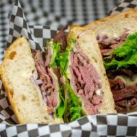 London Broil · Charbroiled London broil steak, thinly sliced, melted provolone with dijonaisse, mixed green...