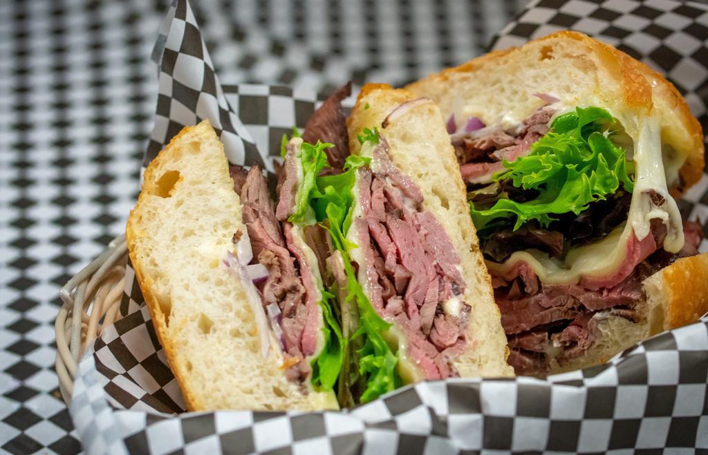 London Broil · Charbroiled London broil steak, thinly sliced, melted provolone with dijonaisse, mixed greens and onions on warm ciabatta.
