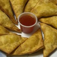 Crab-Meat Rangoon (5) · Fried wontons filled with crabmeat and cream cheese.
