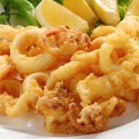 Calamari · Fried calamari served with sweet chili dipping sauce on the side.