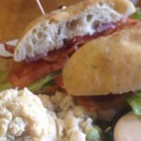 Rosemary Chicken · Marinated breast of chicken topped with cheddar and bacon served on focaccia bread. Offered ...