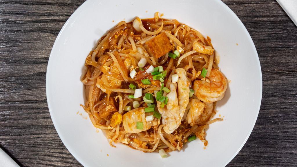 Pad Thai · Rice noodles, egg, tofu, bean sprouts, scallions in our traditional homemade sauce with chopped peanuts on the side.