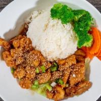 Sesame Chicken · Breaded chicken stir-fried with sweet and sour sauce and topped with sesame seeds.
