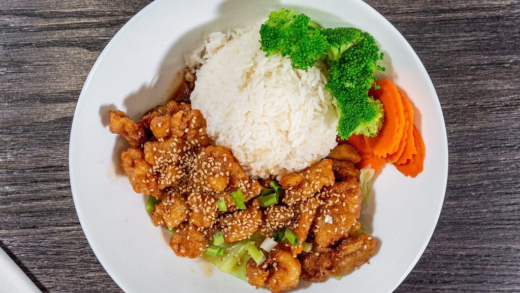 Sesame Chicken · Breaded chicken stir-fried with sweet and sour sauce and topped with sesame seeds.