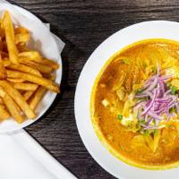 Khao Soi · French Fries, sliced red onion, green onion in homemade coconut curry.