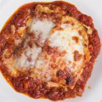 Lasagna · Layers of noodles with Bolognese sauce filled with three kinds of cheese.