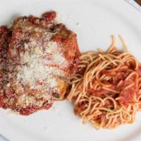 Eggplant Parmigiano · Layers of battered eggplant in a light marinara, topped with parmigiano cheese and baked. Se...
