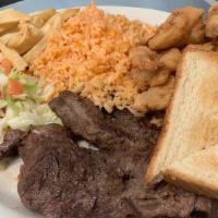 Steak & Shrimp · 8oz. sirloin steak cooked on the grill served with six breaded shrimps. Accompanied with ric...