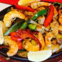 A La Casa Fajitas · Speciality plate, beef, chicken and shrimp. With onions bell pepper, with rice beans, pico d...