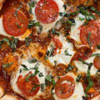 Margherita Pizza · Marinara, Fresh Mozzarella, Basil, Roasted Tomatoes, Topped with Parmesan.
