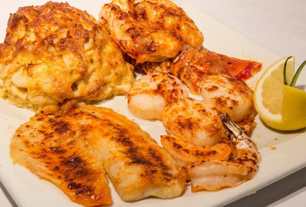 Jewels Of The Sea · Petite Lobster Tail, 8 oz Crab Cake, Jumbo Shrimp & Jumbo Scallops broiled & served with drawn butter