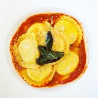 Ravioli Burro & Salvia · Cheese filled ravioli, served on a bed of marinara sauce, and sage reduction and parmesan ch...