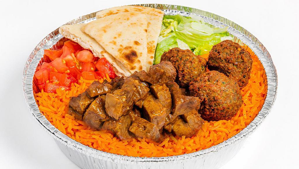 Savory Herb Beef & Falafel Platter · Tender, seared sirloin marinated in a Savory spice blend with crispy falafel atop a bed of basmati rice and served with lettuce, tomato, and pita