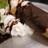 Cannoli · Chocolate dipped cannoli filled with sweet ricotta cheese & chocolate chips