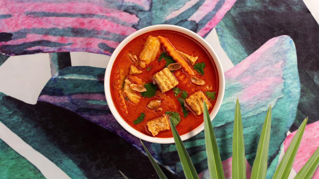 Massaman Curry · Red style curry with dry whole spices and peanuts with your choice of tofu or vegetables.