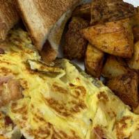 Lj'S Omelet · Bacon, sausage, ham, onions, sweet pepper and mixed cheese.