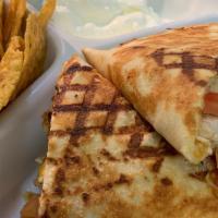 Grilled Chicken Quesadilla · Chicken, green peppers, tomatoes and mixed cheese with a side of chips, salsa and sour cream.