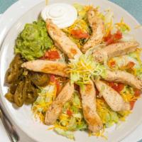 Grilled Chicken Salad · Strips of grilled chicken with Lettuce, tomatoes, onions and bell pepper.