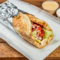 Mediterranean Shrimp And Chicken Wrap Combo · Marinated shrimp and chicken with a bread, chopped salad and topped with homemade sauces. Se...