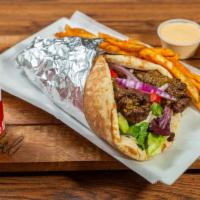 Mediterranean Koobideh Wrap Combo · Seasoned ground beef in a bread with chopped salad and topped with homemade sauces. Served w...