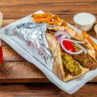 Mediterranean Chicken Koobideh Wrap · Seasoned 2 skewers of ground chicken in a bread with chopped salad and topped with homemade ...