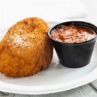 Arancina ( Rice Ball) · A traditional Sicilian treat. Rice ball stuffed with ground beef, sweet peas, and a touch of...