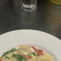Chicken Ravioli · Gluten free. Stuffed with chicken, kale, ricotta, parmigiano and fontina cheese, roosted gar...
