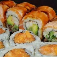 Crazy Salmon Roll · Pescatarian. Spicy salmon, avocado inside, top with salmon, mayo, seared, salmon roe, parsley.