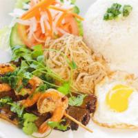 Rice Plate Special (Cơm Đặc Biệt) · Your choice of: lemongrass chicken, beef, or pork chop. Served with fried egg, grilled shrim...