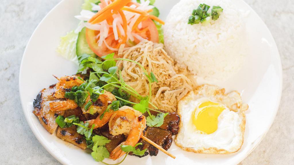 Rice Plate Special (Cơm Đặc Biệt) · Your choice of: lemongrass chicken, beef, or pork chop. Served with fried egg, grilled shrimp, rice, and vegetables.