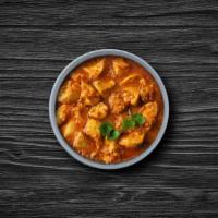 Homestyle Chicken Curry · Tender morsels of chicken cooked in a classic brown curry with Indian whole spices. Served w...