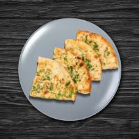Garlic Blast Naan · House-made pulled and leavened dough pressed with finely chopped garlic and baked to perfect...