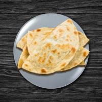 Naan  · House-made pulled and leavened dough baked to perfection in an Indian clay oven.