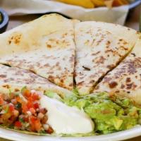 Quesadilla - Cheese · Two fresh flour tortillas stuffed with monterrey jack and cheddar cheese. Served with guacam...