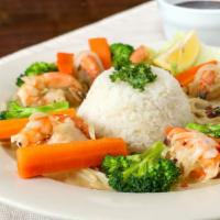 Camarones Encebollados · A generous portion of shrimp sauteed with white wine, Spanish onions, garlic, and crushed fr...